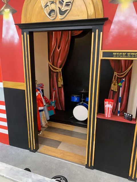 The Theatre’s stage entrance and red curtains